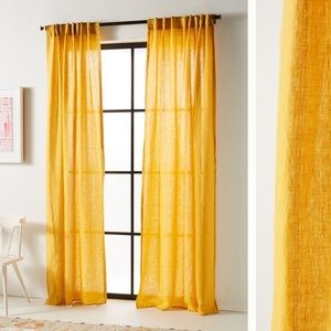 Pair of Anthropologie stitched linen drapes in ochre. 50x85”